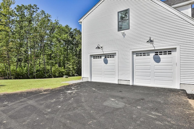 garage featuring aphalt driveway