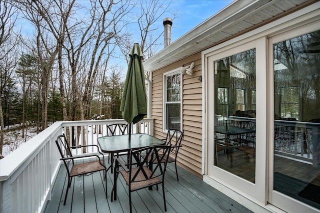 wooden deck featuring outdoor dining space