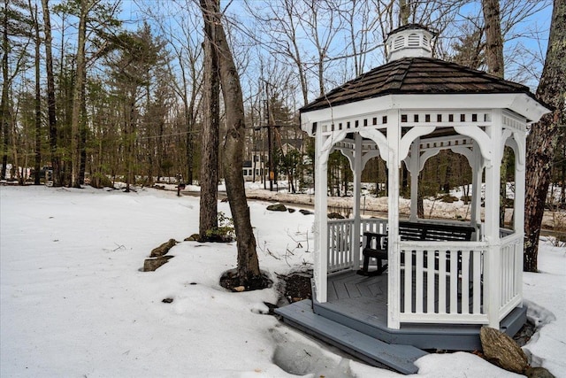 yard covered in snow with a gazebo