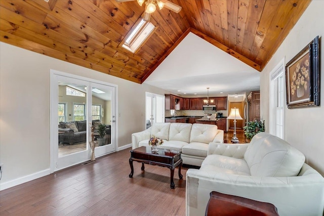 living room with a ceiling fan, baseboards, high vaulted ceiling, dark wood finished floors, and wood ceiling