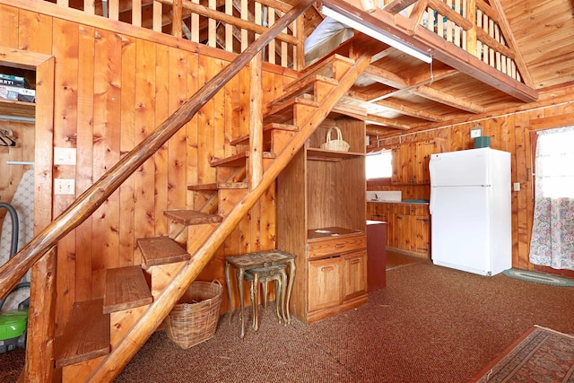 stairs with wooden walls and carpet