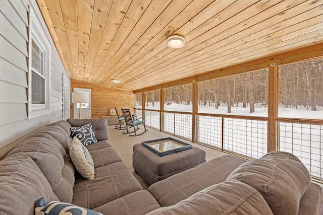 living area with wood walls and wood ceiling