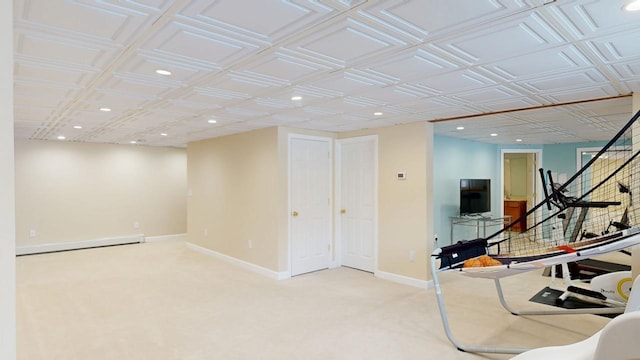 workout area with recessed lighting, a baseboard heating unit, baseboards, and light colored carpet