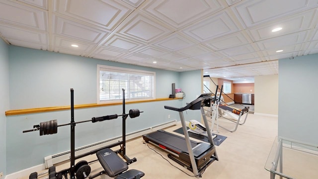 exercise room featuring recessed lighting, a baseboard radiator, baseboards, and a healthy amount of sunlight