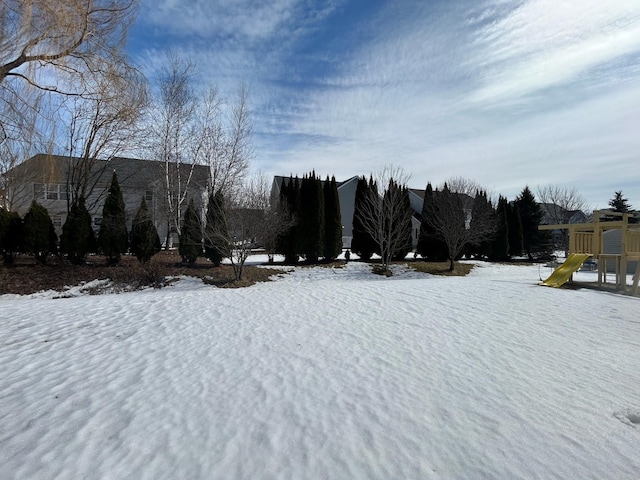 view of yard layered in snow