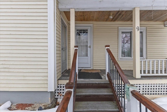 property entrance with covered porch