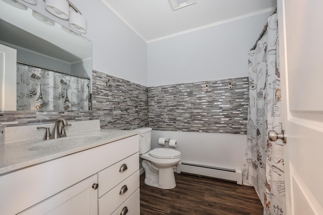 full bathroom featuring toilet, a baseboard heating unit, wood finished floors, crown molding, and vanity