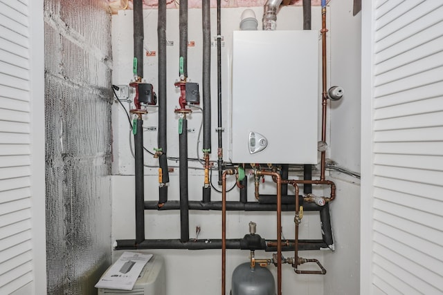 utility room featuring water heater