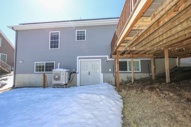 rear view of property with ac unit