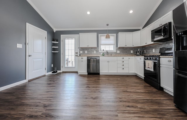 kitchen with white cabinetry, tasteful backsplash, appliances with stainless steel finishes, and a sink