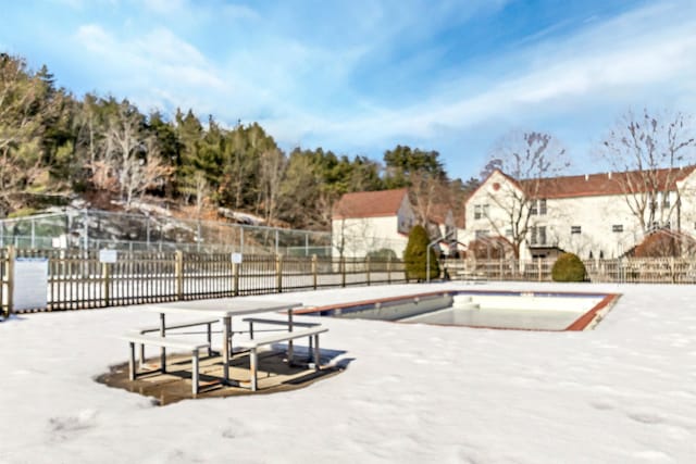 community pool featuring fence