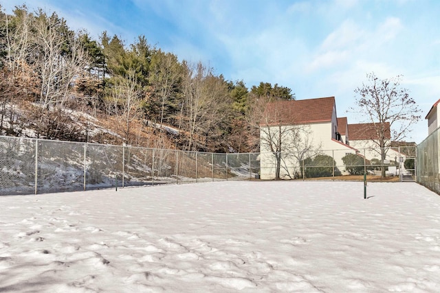 view of sport court featuring fence