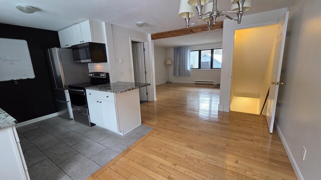 kitchen featuring a baseboard radiator, electric range, light wood finished floors, and white cabinetry