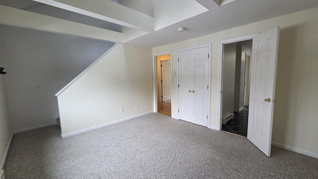 unfurnished bedroom with baseboards and carpet floors