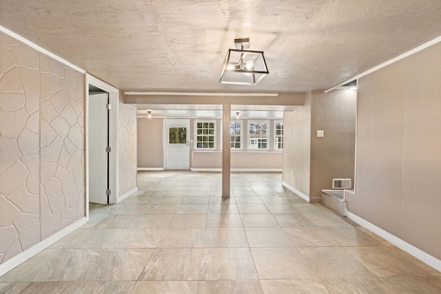 hall with visible vents and baseboards