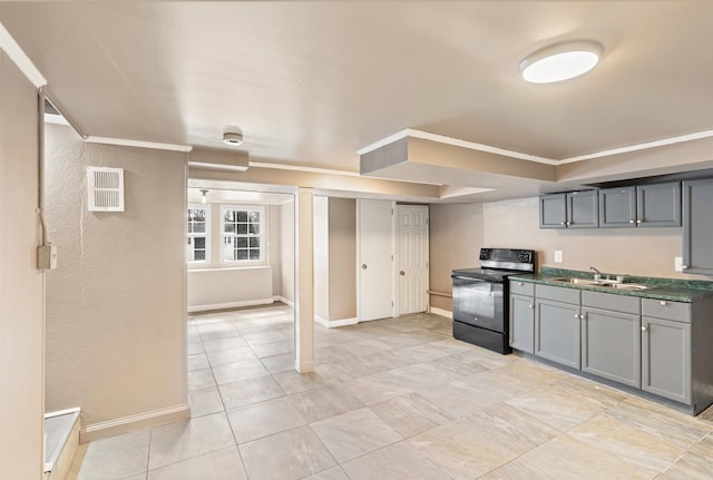 kitchen with gray cabinets, black electric range oven, baseboards, and ornamental molding