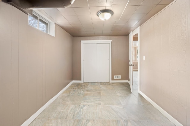 interior space featuring baseboards and visible vents