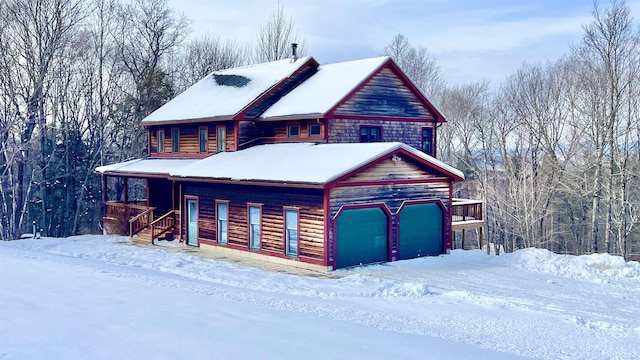 view of front of home with a porch and an attached garage