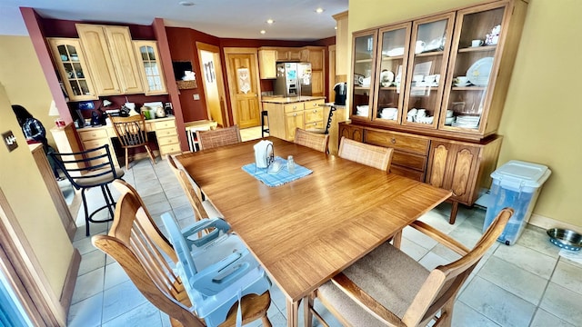 dining area with light tile patterned floors, recessed lighting, built in study area, and baseboards