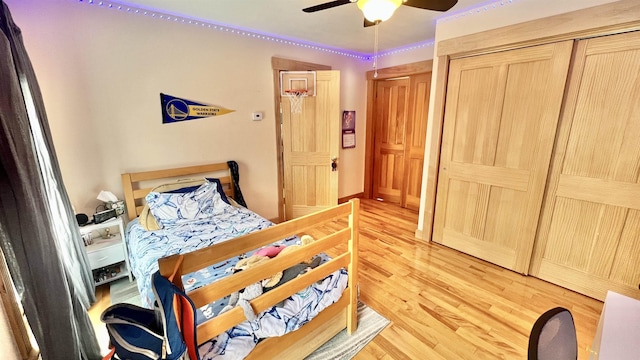 bedroom featuring light wood-type flooring and a ceiling fan