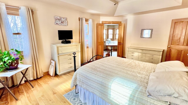 bedroom with light wood finished floors