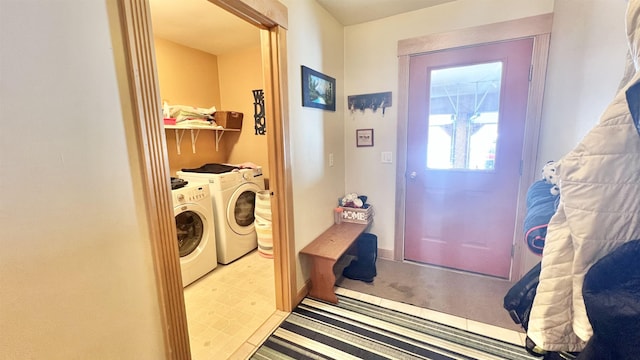 washroom featuring laundry area and separate washer and dryer