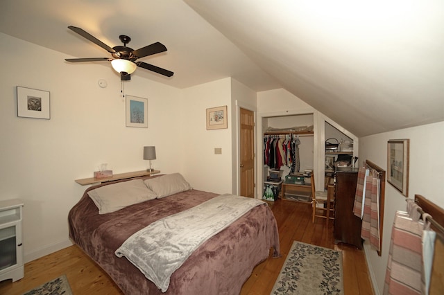 bedroom with ceiling fan, hardwood / wood-style flooring, a closet, and vaulted ceiling