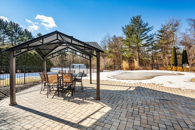 view of patio with a gazebo and fence