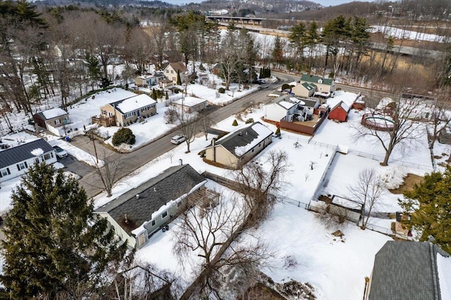 snowy aerial view with a residential view