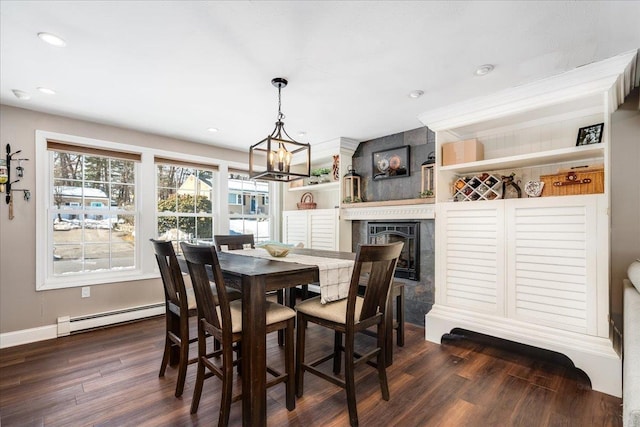 dining area featuring baseboards, a chandelier, baseboard heating, recessed lighting, and dark wood-style floors