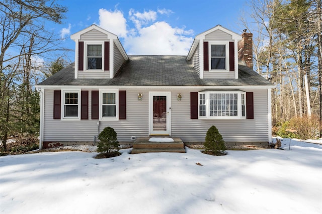 cape cod house with a chimney