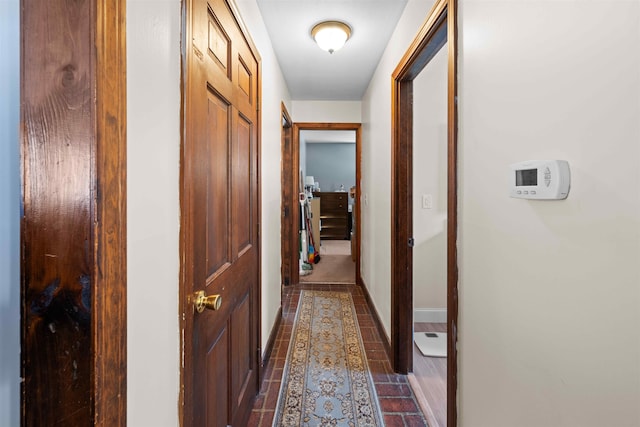 corridor featuring baseboards