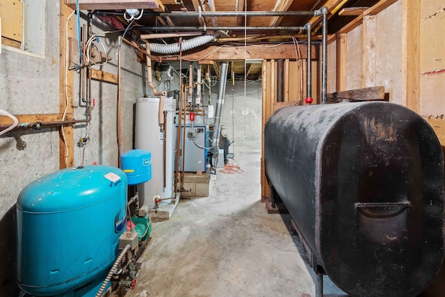 unfinished below grade area with water heater, a heating unit, and heating fuel