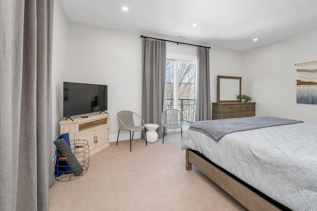 bedroom with light carpet and recessed lighting