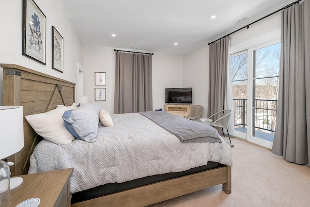 carpeted bedroom with recessed lighting, visible vents, and access to exterior