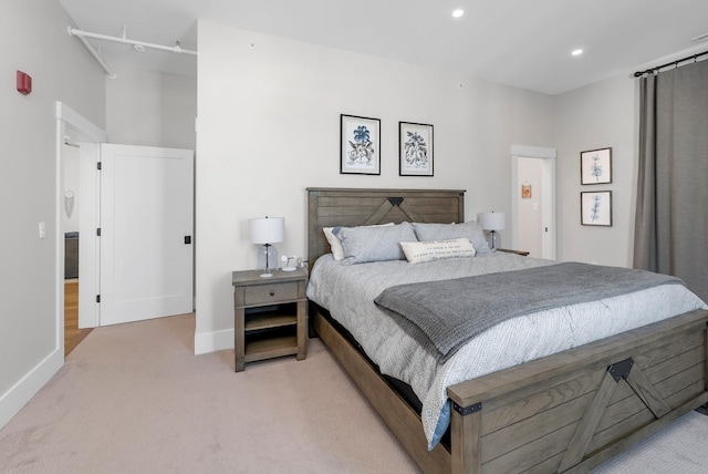 bedroom with recessed lighting, light colored carpet, and baseboards