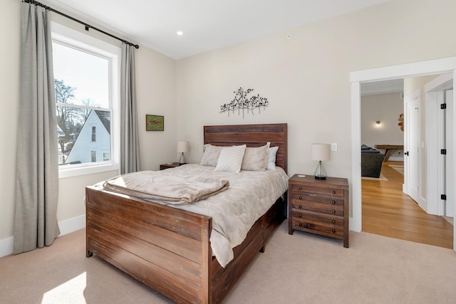 bedroom featuring light carpet