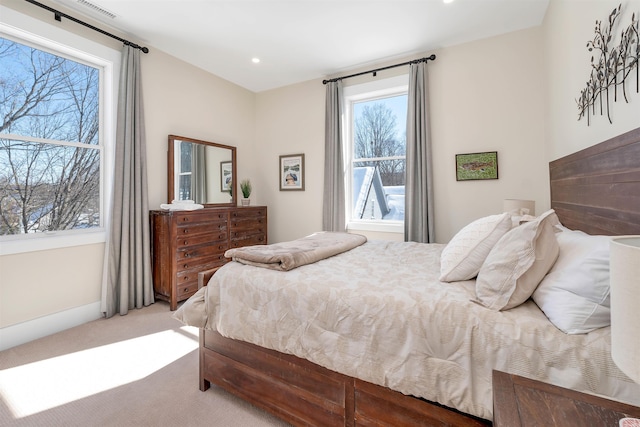 carpeted bedroom featuring visible vents, recessed lighting, and baseboards