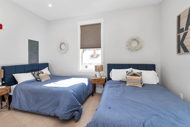 bedroom with electric panel, carpet, and recessed lighting