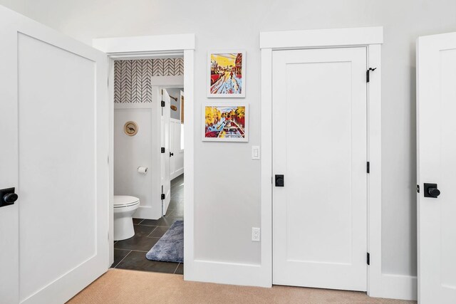 bathroom featuring tile patterned flooring and toilet