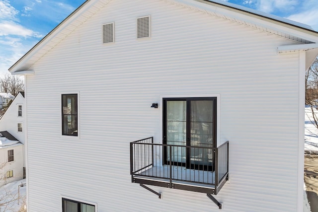 back of house featuring a balcony