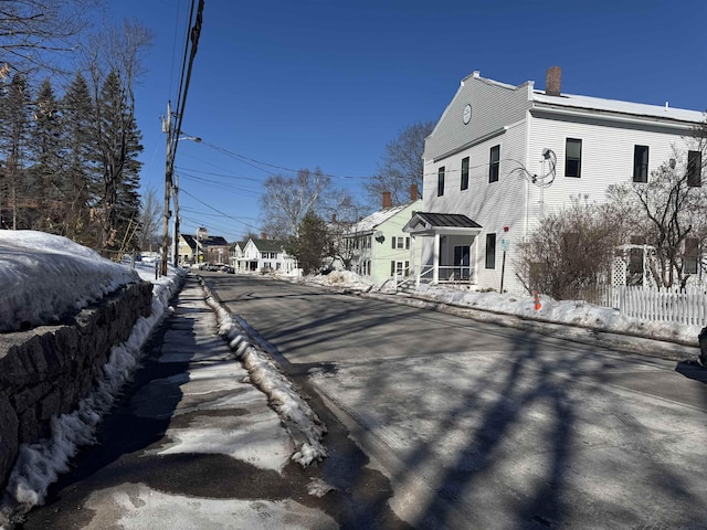 view of road with curbs and sidewalks