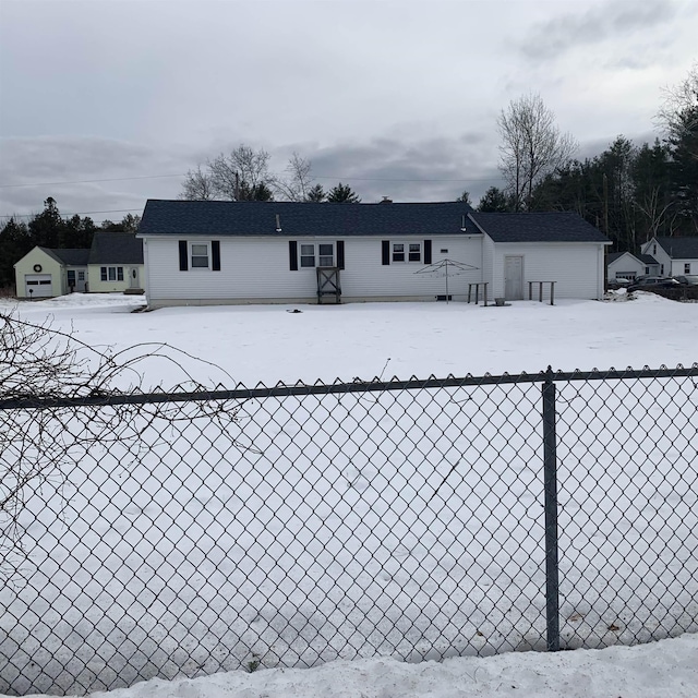 view of front of property featuring an outbuilding and fence