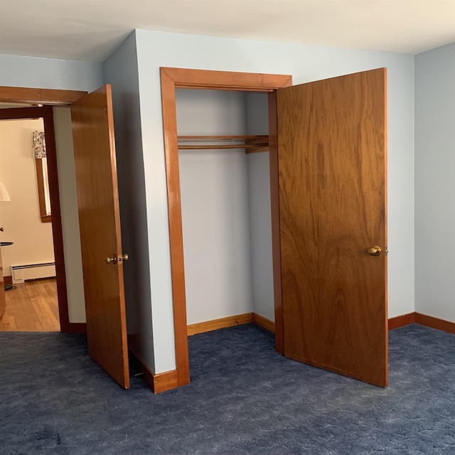 closet featuring a baseboard radiator