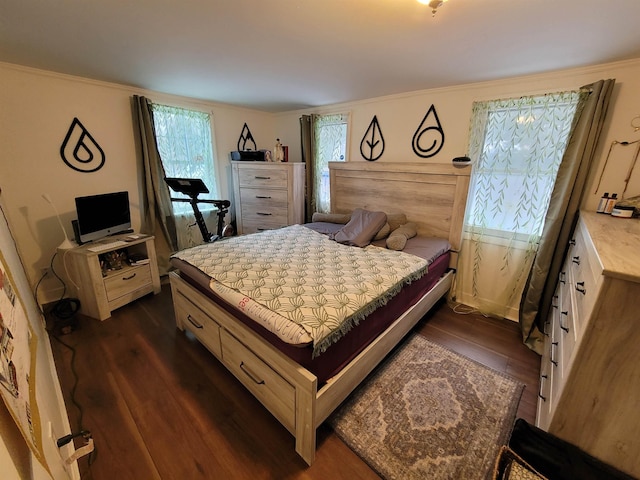 bedroom with dark wood-style floors