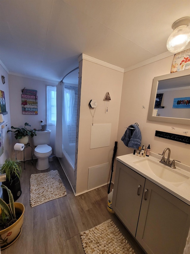 full bath with vanity, toilet, wood finished floors, and ornamental molding