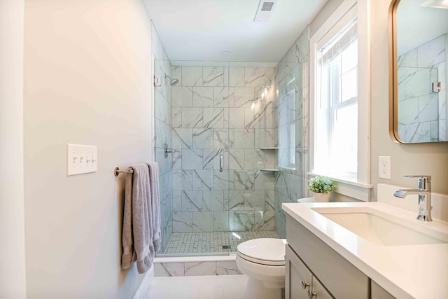 full bath featuring visible vents, toilet, a stall shower, marble finish floor, and vanity