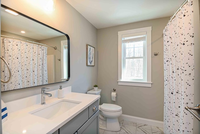 full bath with baseboards, toilet, a shower with shower curtain, marble finish floor, and vanity