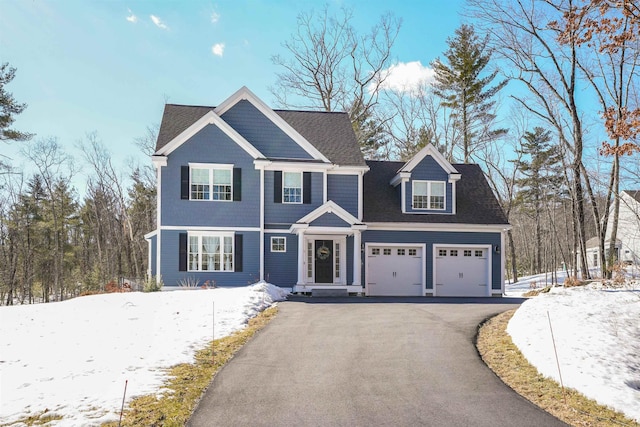 view of front of home featuring an attached garage and driveway