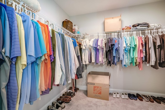 walk in closet featuring carpet